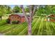 Backyard view of the property with manicured lawn and lush greenery at 326 N Greenbriar Rd, Statesville, NC 28625