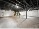 Unfinished basement with exposed pipes and concrete flooring, ready for customization at 326 N Greenbriar Rd, Statesville, NC 28625