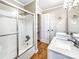 Bathroom featuring double sinks and a glass-enclosed shower with shelves at 326 N Greenbriar Rd, Statesville, NC 28625