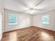 Bedroom with hardwood floors, natural light, and a ceiling fan at 326 N Greenbriar Rd, Statesville, NC 28625