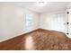 Bedroom with hardwood floors, natural light, and a large closet at 326 N Greenbriar Rd, Statesville, NC 28625