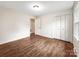 Bedroom featuring hardwood floors and a double door closet at 326 N Greenbriar Rd, Statesville, NC 28625