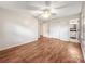 Spacious bedroom with hardwood floors, ceiling fan, and large closet at 326 N Greenbriar Rd, Statesville, NC 28625