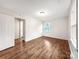 Bedroom with hardwood floors and a window at 326 N Greenbriar Rd, Statesville, NC 28625