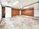 Spacious garage with a brick wall and plenty of room for parking and storage at 326 N Greenbriar Rd, Statesville, NC 28625