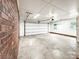 A garage space with a closed door and ample room for parking and storage at 326 N Greenbriar Rd, Statesville, NC 28625