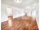 Open living area featuring hardwood floors and a view of the home's entrance at 326 N Greenbriar Rd, Statesville, NC 28625