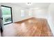 Open and airy living room with hardwood floors and lots of natural light at 326 N Greenbriar Rd, Statesville, NC 28625