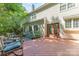 A backyard deck features outdoor seating, perfect for enjoying the peaceful surroundings and outdoor living at 3710 Cheleys Ridge Ln, Charlotte, NC 28270