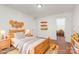 bedroom with hardwood floors, a wooden bed frame, and charming decor at 3710 Cheleys Ridge Ln, Charlotte, NC 28270