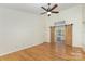 The bright primary bedroom features hardwood floors and barn doors leading to an en-suite bathroom at 3710 Cheleys Ridge Ln, Charlotte, NC 28270
