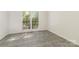 Sunlit bedroom with large window and tile flooring at 3710 Cheleys Ridge Ln, Charlotte, NC 28270