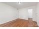 Spacious bedroom with hardwood floors, ample closet space, and neutral walls creating a calming retreat at 3710 Cheleys Ridge Ln, Charlotte, NC 28270