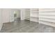 Flex room with built-in shelving and tile flooring provides versatile space for work or recreation at 3710 Cheleys Ridge Ln, Charlotte, NC 28270