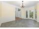 Bright dining room featuring a chandelier, large windows, and views of the landscaped outdoors at 3710 Cheleys Ridge Ln, Charlotte, NC 28270