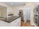 Kitchen with granite counters, stainless refrigerator and pantry at 3710 Cheleys Ridge Ln, Charlotte, NC 28270