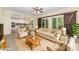 Sun-filled living room featuring a comfortable couch, chairs, and stylish decor at 3710 Cheleys Ridge Ln, Charlotte, NC 28270