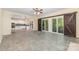 Open living room with tile flooring and sliding doors to the outside at 3710 Cheleys Ridge Ln, Charlotte, NC 28270