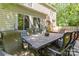 Outdoor patio area showcasing a stone table and chairs, perfect for dining and entertaining guests at 3710 Cheleys Ridge Ln, Charlotte, NC 28270