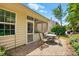 Charming backyard patio featuring a table with seating, pavers, and a glimpse of the screened porch at 4093 Perth Rd, Fort Mill, SC 29707