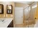 Bathroom featuring a walk-in shower with glass door and ample vanity counter space at 4093 Perth Rd, Fort Mill, SC 29707