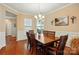 Bright dining room with hardwood floors and elegant wainscoting detail at 4093 Perth Rd, Fort Mill, SC 29707