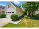 Inviting exterior of home with attached garage and lush, green landscaping at 4093 Perth Rd, Fort Mill, SC 29707