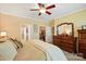 Bright primary bedroom with a dresser, large bed, and access to a walk-in closet and en suite at 4093 Perth Rd, Fort Mill, SC 29707