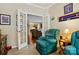 Cozy office featuring glass paneled french doors to the living room for connection and privacy at 4093 Perth Rd, Fort Mill, SC 29707