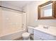 Bathroom featuring a bathtub, white cabinets, and new laminate flooring at 427 Pinnacle Ln, Huntersville, NC 28078
