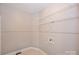 Walk in closet featuring shelving and new tile flooring at 427 Pinnacle Ln, Huntersville, NC 28078