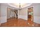 Dining area with hardwood flooring, elegant chandelier, and direct access to the kitchen at 427 Pinnacle Ln, Huntersville, NC 28078