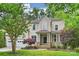 Two story traditional home with a manicured lawn and an attached two car garage at 427 Pinnacle Ln, Huntersville, NC 28078
