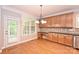 A cozy breakfast nook showcases hardwood floors, cabinetry, and counterspace with a window for natural light at 427 Pinnacle Ln, Huntersville, NC 28078