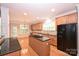 Bright kitchen features hardwood floors, stainless sink, granite countertops, and stainless steel appliances at 427 Pinnacle Ln, Huntersville, NC 28078