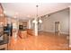 Spacious kitchen with a central island, hardwood floors, granite countertops, and modern appliances at 427 Pinnacle Ln, Huntersville, NC 28078