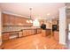 Kitchen featuring granite countertops, wood cabinets, an island, and stainless steel appliances at 427 Pinnacle Ln, Huntersville, NC 28078