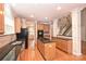 A stylish kitchen features hardwood floors, granite countertops, and a central island with a built-in stovetop at 427 Pinnacle Ln, Huntersville, NC 28078