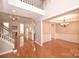 Open floor plan showcasing a large living room with a fireplace and wood flooring at 427 Pinnacle Ln, Huntersville, NC 28078