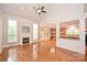 Bright living room with a fireplace, fan, and hardwood flooring at 427 Pinnacle Ln, Huntersville, NC 28078