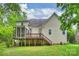 Exterior rear view of a home with a spacious deck and a screened-in porch overlooking the backyard at 427 Pinnacle Ln, Huntersville, NC 28078