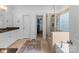 Well-lit bathroom with double vanity, large walk-in shower, and separate water closet at 440 S Sharon Amity Rd, Charlotte, NC 28211