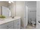 Clean bathroom with single vanity, shower, and neutral finishes at 440 S Sharon Amity Rd, Charlotte, NC 28211