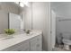 Clean bathroom with a large mirror and a neutral color scheme at 440 S Sharon Amity Rd, Charlotte, NC 28211