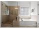 Elegant bathroom with a separate shower and soaking tub, showcasing modern fixtures at 440 S Sharon Amity Rd, Charlotte, NC 28211