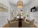 Charming breakfast nook with a round table, comfortable seating, and abundant natural light at 440 S Sharon Amity Rd, Charlotte, NC 28211