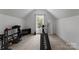 Bright exercise room featuring Total Gym equipment and a large window at 440 S Sharon Amity Rd, Charlotte, NC 28211