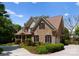 Charming brick home with attached garage and lush landscaping, offers comfort and convenience at 440 S Sharon Amity Rd, Charlotte, NC 28211