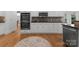 Modern kitchen with stainless steel appliances, plenty of storage, and a stylish backsplash at 440 S Sharon Amity Rd, Charlotte, NC 28211