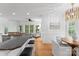 Open-concept kitchen featuring a large island, stainless steel appliances, and hardwood floors at 440 S Sharon Amity Rd, Charlotte, NC 28211